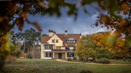 Deben View, on the first floor of Tranmer House, with its balcony overlooking the Sutton Hoo grounds, surrounded by autumn foliage, Suffolk